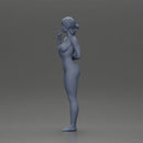 Naked woman standing hand resting on her back speaking into a radio - Only-Games