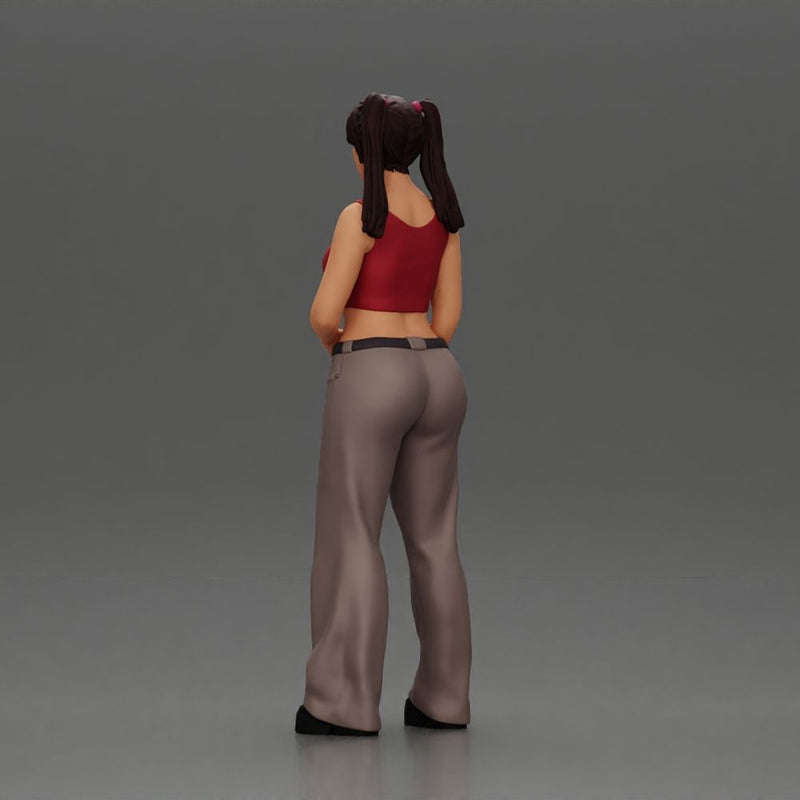 Chola girl with pigtails standing in flared pants