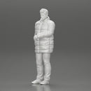 Man in long puffer jacket standing with his hand in his pocket lost in thought - Only-Games