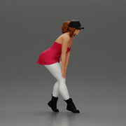 beautiful woman placing her hand on her legs, wearing a cap and a bra top - Only-Games
