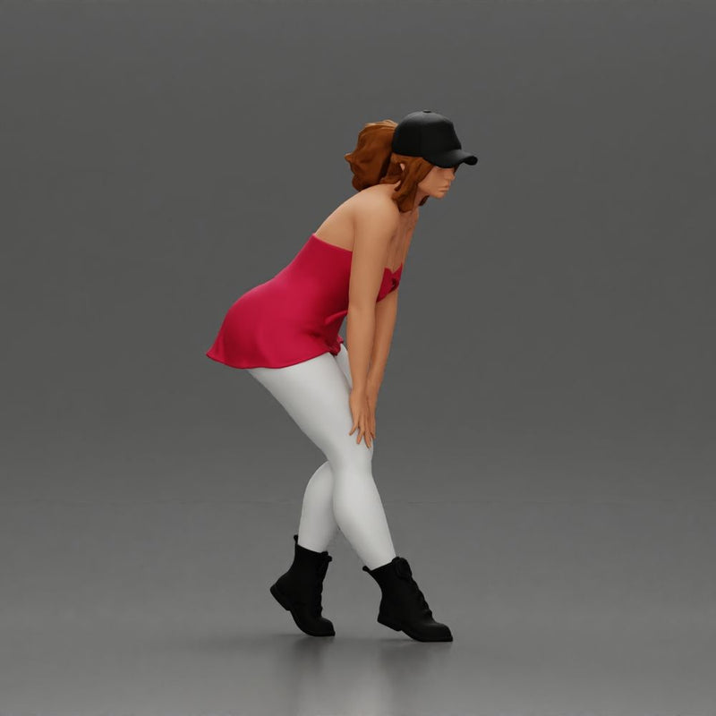 beautiful woman placing her hand on her legs, wearing a cap and a bra top - Only-Games