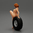 Sexy naked girl sitting on a truck tyre - Only-Games