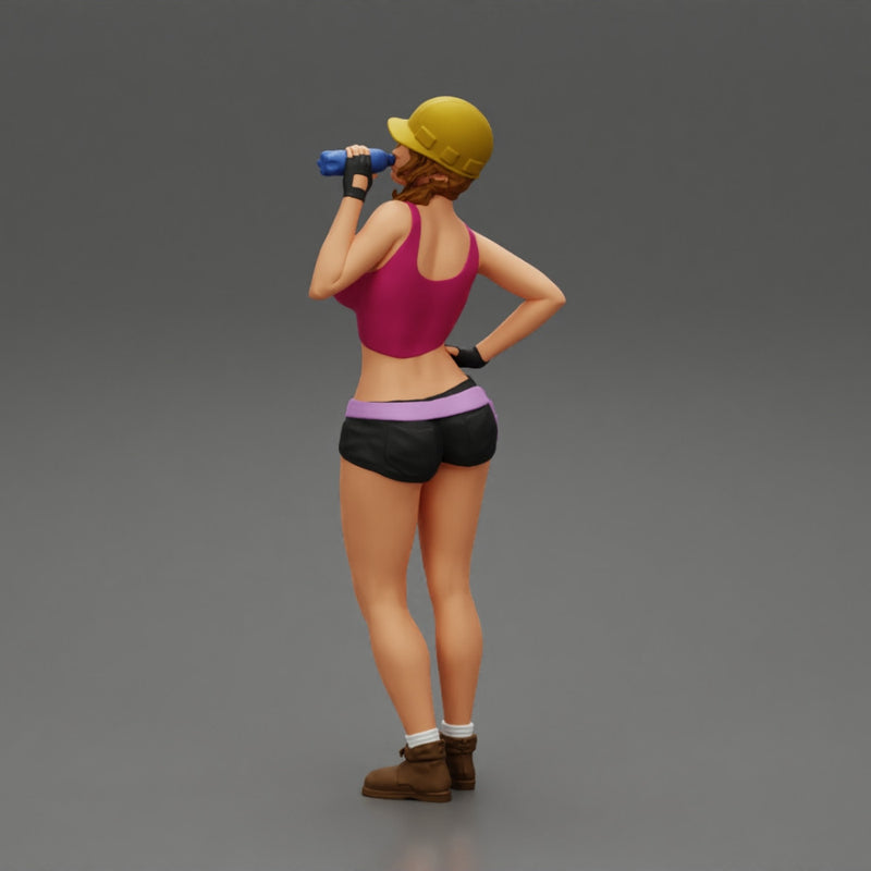 Sexy girl mechanic drinks water during a break - Only-Games