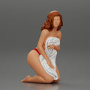 Sexy girl in bikini sitting and covering her body by towel - Only-Games