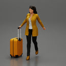 Business woman in manteau dragging suitcase  walking in airport terminal - Only-Games