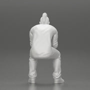 metal man sitting and contemplating with a satanic haircut - Only-Games