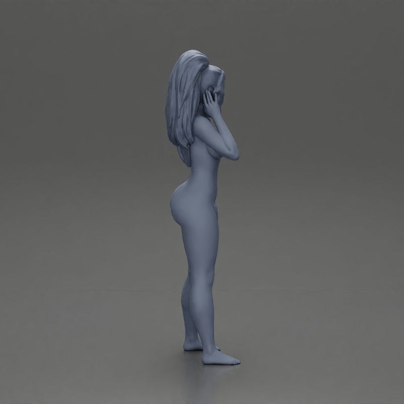 Naked woman  standing thoughtfully