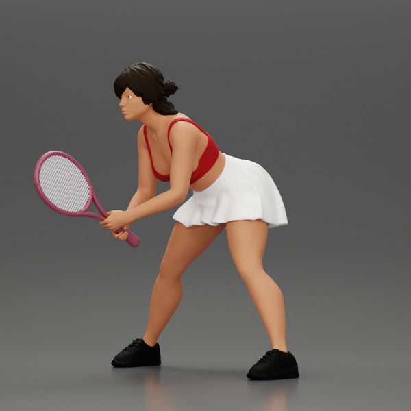 sexy tennis player in skirt holding her racket in a ready position