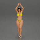 beautiful woman in a bikini with sunglasses standing with her arms raised up on the beach - Only-Games