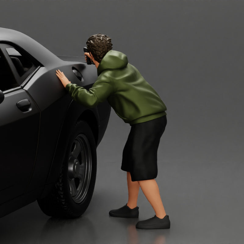 gangster man in a hoodie and shorts shooting a gun behind the car