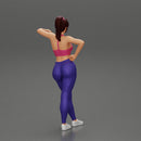 Sexy fitness girl leaning on a wall while standing outdoors - Only-Games