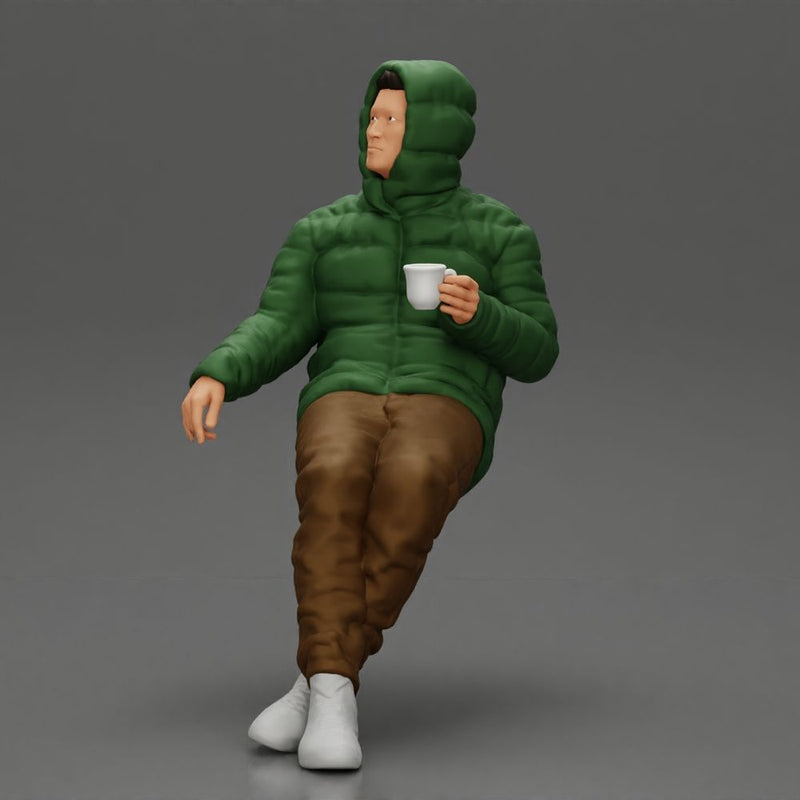 Man Sitting Wearing a Puffer Jacket, Holding a Coffee Cup