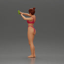 attractive woman in bikini taking a selfie with her phone on the beach - Only-Games