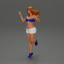 happy girl in a bra  and shorts, jumping on one leg - Only-Games