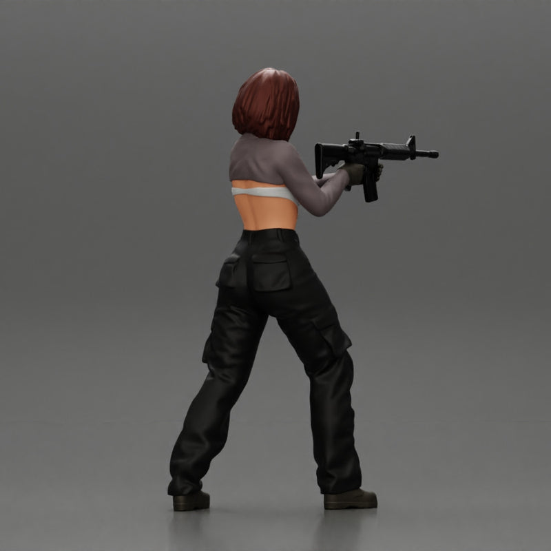 Armed girl going to shoot a gun in a bra with short hair