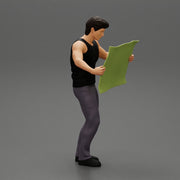 Young Man Holding Map And Looking At It While Standing On The City - Only-Games