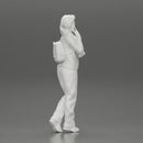 young woman listening to music with headphones and carrying a backpack - Only-Games