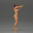 Naked woman taking a selfie with her phone on the beach - Only-Games