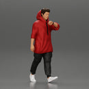 Man in a long hoodie  walking and looking at his watch - Only-Games