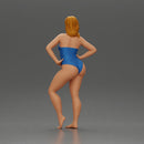 Elegant pose in blue swimsuit showcasing confidence and grace - Only-Games