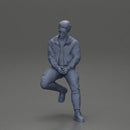 man sitting on a car, wearing a jacket and sunglasses, deep in thought - Only-Games