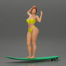 young girl posing and riding on the surfboard at the beach - Only-Games