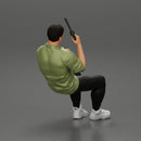 Gangster sitting at the table with a glass of whisky holding gun and playing poker - Only-Games