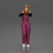 Smiling girl in overalls showing a thumbs up with both hands - Only-Games