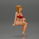 sexy girl in a bikini posing on the beach sitting at the deck chair - Only-Games