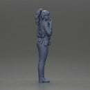 policewoman standing hand resting on her back speaking into a radio - Only-Games