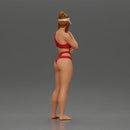 Sexy girl in a bikini and an empty top cap, thinking on the beach - Only-Games