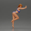 Woman in a bikini leaning on the car with her hands on the beach - Only-Games