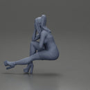 Woman in Pink Dress and heels sitting Deep in Thought - Only-Games