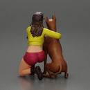 Young woman in a cap and mini jacket sitting and hugging her happy dog - Only-Games