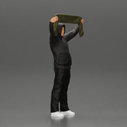man in a hoodie supporting and holding a scarf - Only-Games