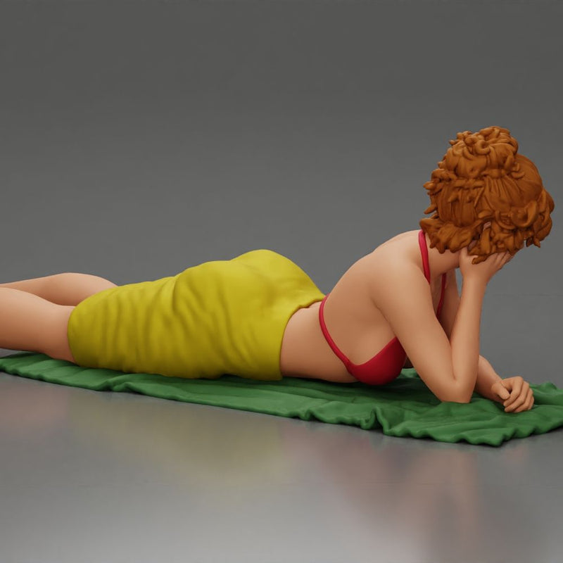 Relaxing on a beach towel, a woman enjoys sunbathing, wrapped in a pareo beach cover and bikini - Only-Games