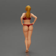 Fit hot woman in bikini taking off swimsuit panties on the beach - Only-Games