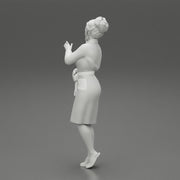 woman in a white bathrobe standing - Only-Games