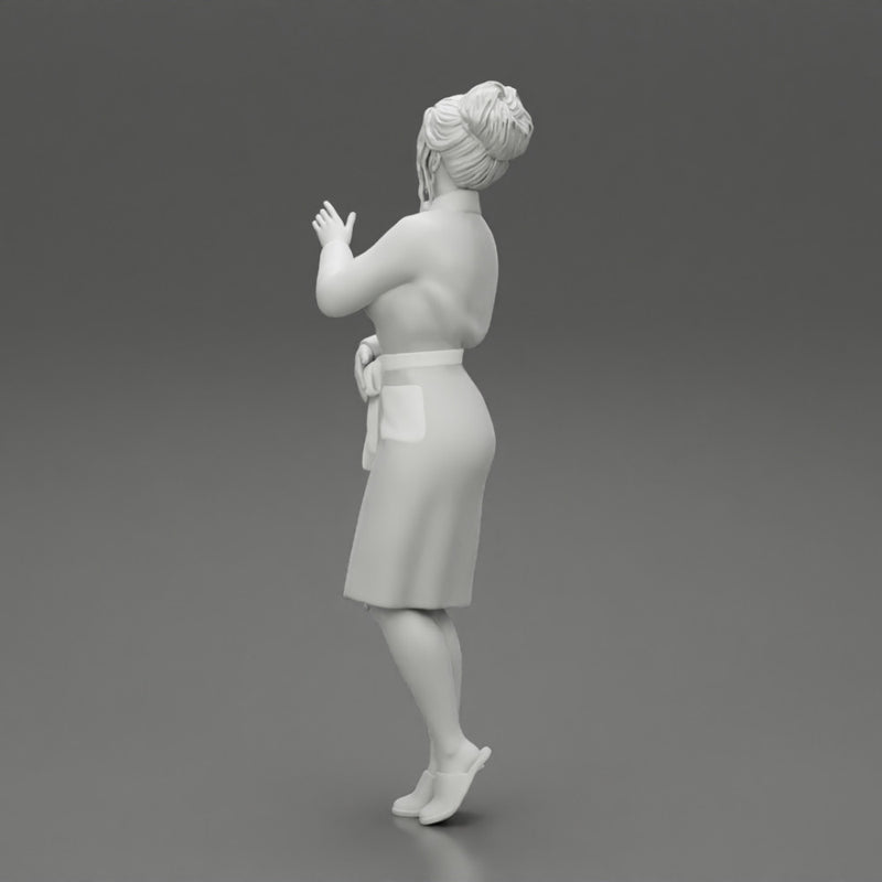 woman in a white bathrobe standing - Only-Games