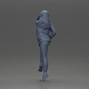 Young woman in  shirt with long hair posing with one foot resting on the motorcycle - Only-Games