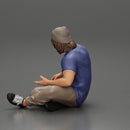 young man in a bonnet sitting crossing his legs and hugging a dog - Only-Games