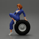 2 Models - Sexy girl mechanic in suit sitting on a truck tyre 2 - Only-Games