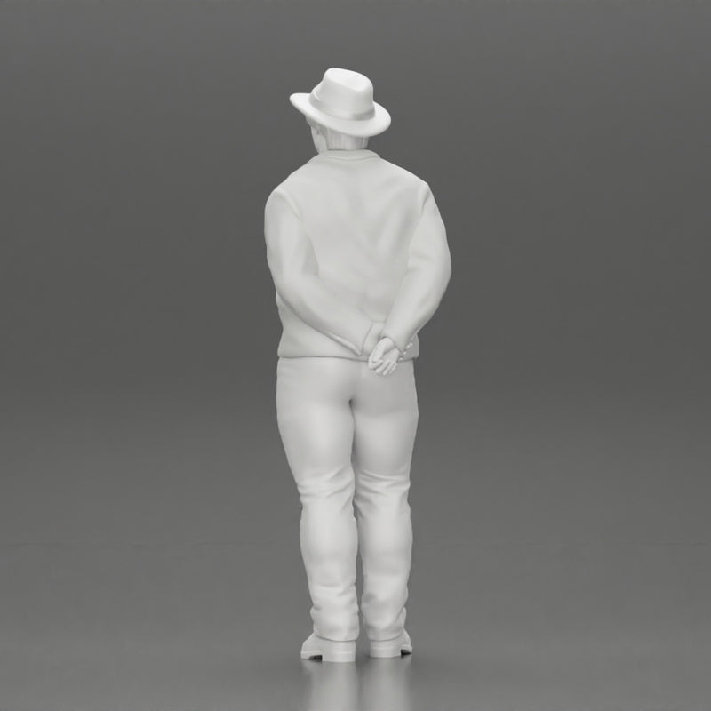 Man in a hat putting hands behind his back ( pablo escobar )