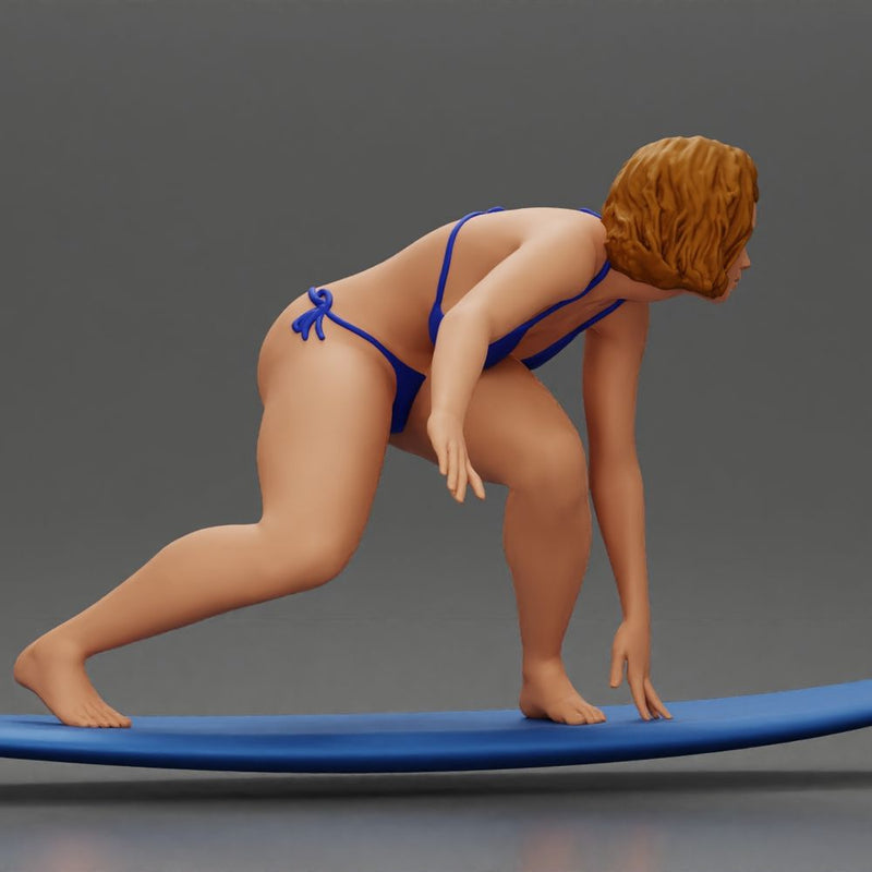 Confident surfer woman in a bikini, riding a wave on her surfboard