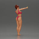 attractive woman in bikini taking a selfie with her phone on the beach - Only-Games