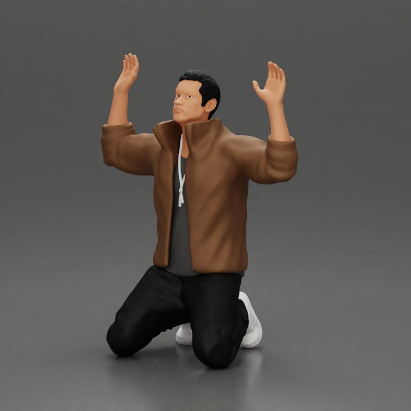 Asian gangster man in jacket sitting with his hands up ready to be arrested