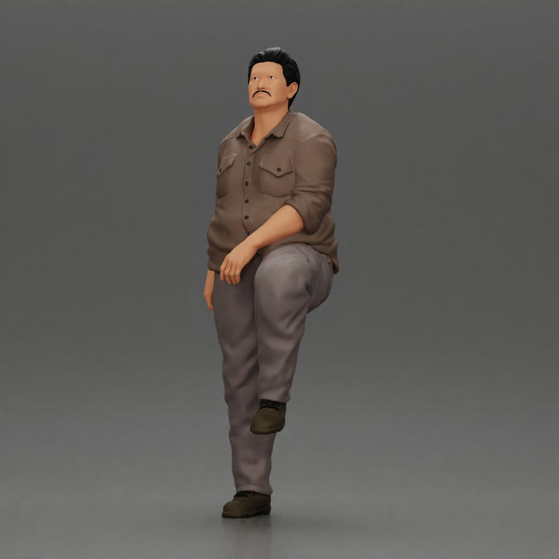 Fat Asian man looking upward in shirt and pants with one leg placed on a step