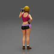 Sexy girl mechanic drinks water during a break - Only-Games