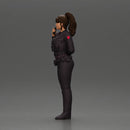policewoman standing hand resting on her back speaking into a radio - Only-Games