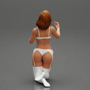 Sexy girl in bikini lingerie sitting on her knees - Only-Games